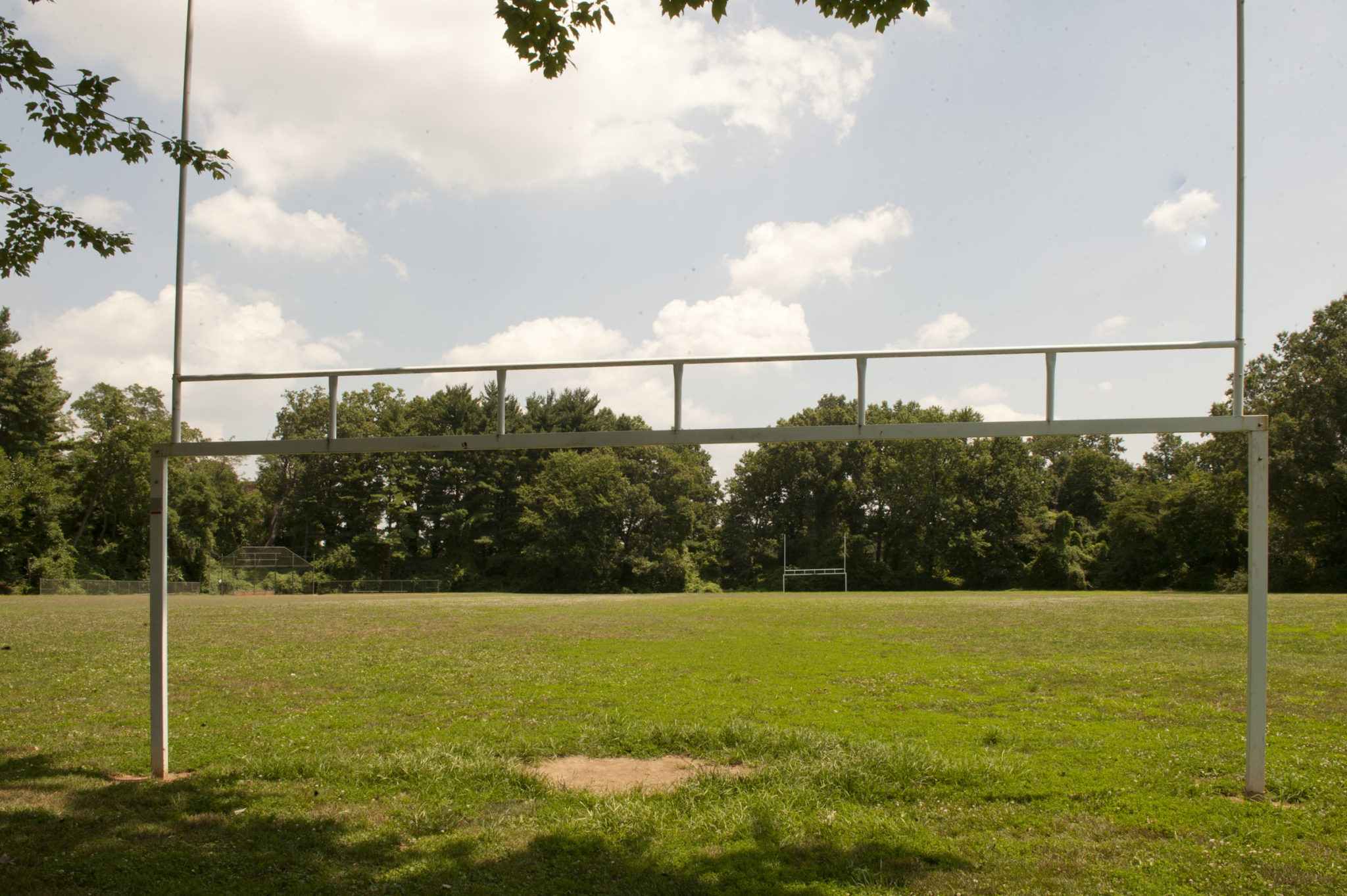 Empty Maplewood field framed by the large goal and trees.